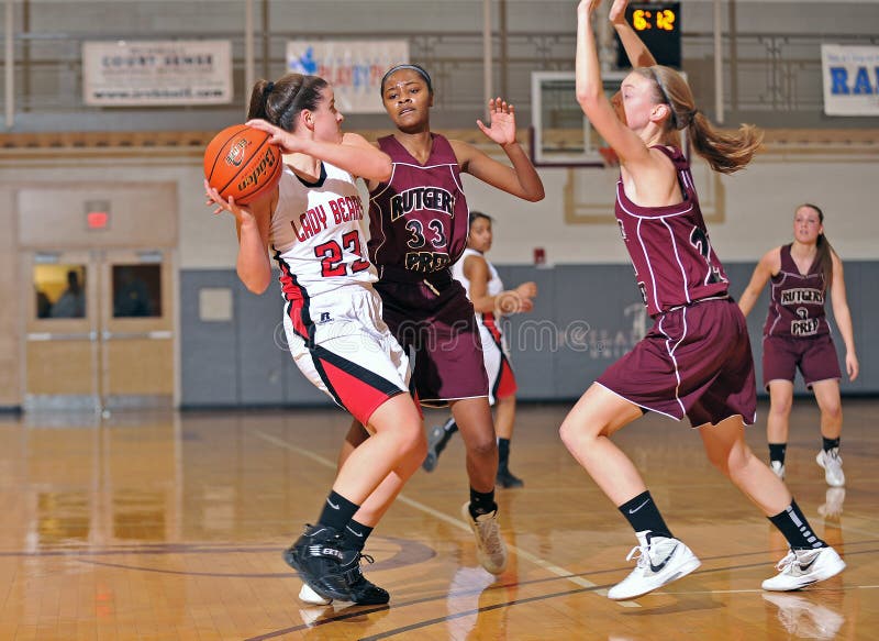 PHILADELPHIA - JANUARY 14: Olivia Cavallo (#23) of Boyertown HS protects the ball as Rutgers Prep defenders trap her during a game in the Rally Girls Play by Play Classic in Philadelphia. PHILADELPHIA - JANUARY 14: Olivia Cavallo (#23) of Boyertown HS protects the ball as Rutgers Prep defenders trap her during a game in the Rally Girls Play by Play Classic in Philadelphia.