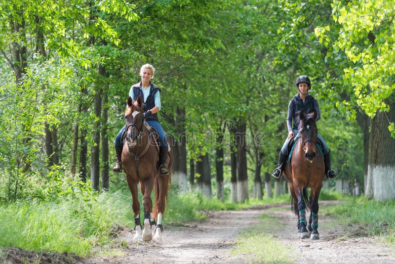 Girls on horseback riding