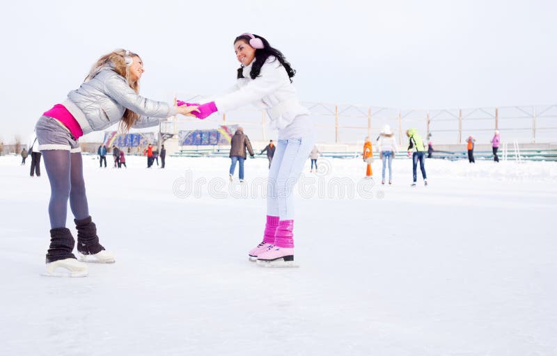 Girls ice skating stock image. Image of casual, cheerful 18413471