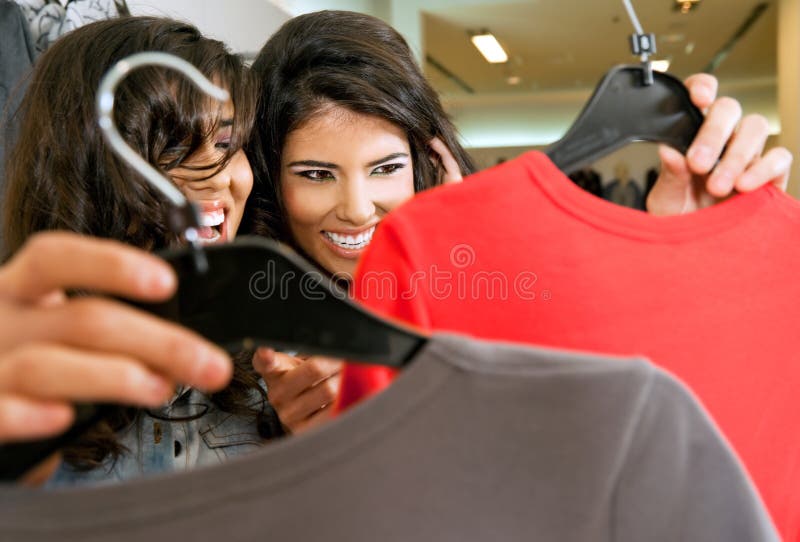 Girls lookig at clothes royalty free stock photos Girls lookig at clothes royalty free stock photos