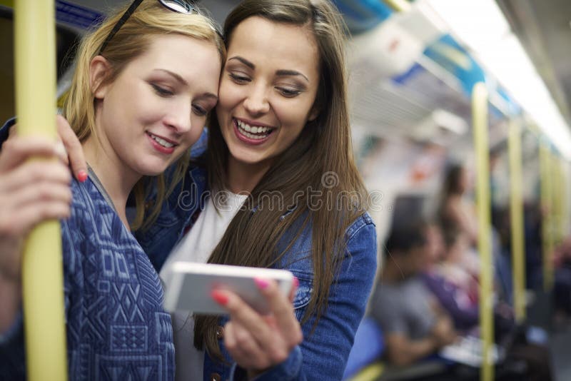 Girls in metro stock photo. Image of sign, showing, pointing 58880642