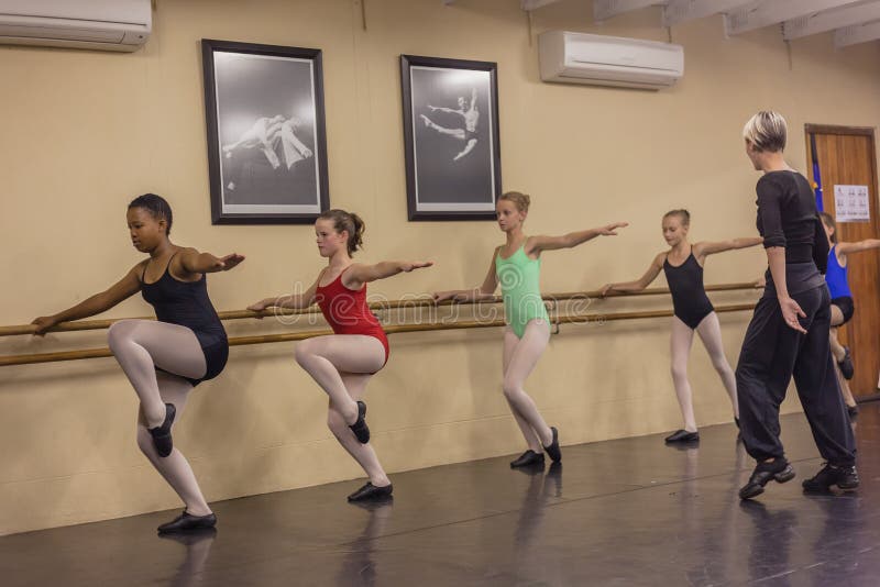 Young girls modern dancing moves with instructor at open day at Michelle Popes Dance Studio in Pinetown South-Africa. Young girls modern dancing moves with instructor at open day at Michelle Popes Dance Studio in Pinetown South-Africa.