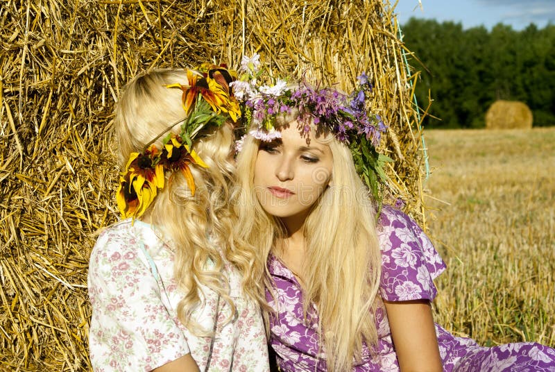 Girls near haystacks