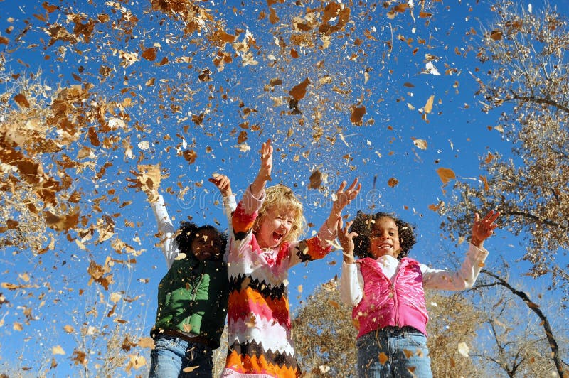 Girls playing with leaves