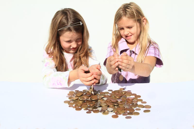 Girls pooring money thru hands