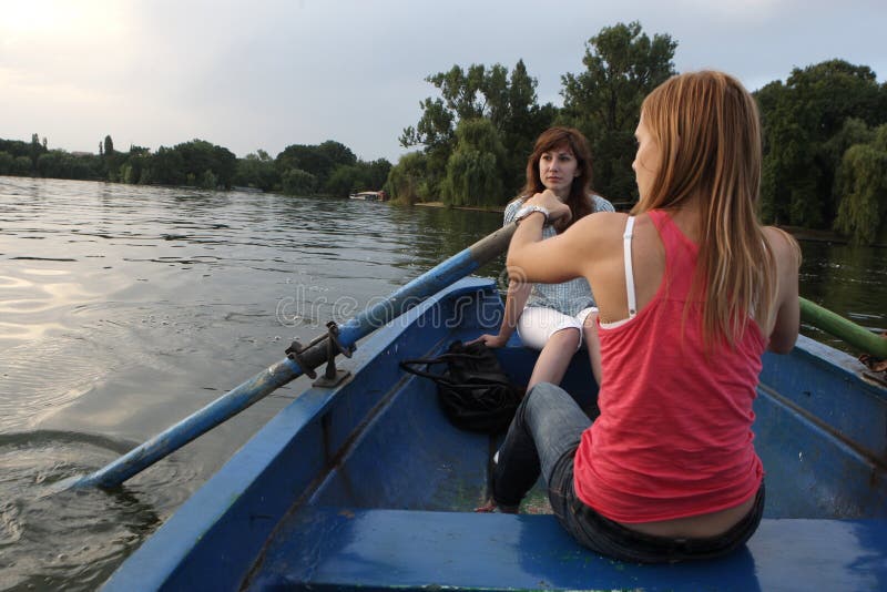 Girls rowing a boat