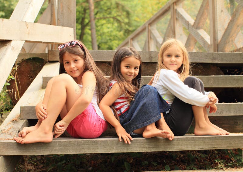 Girls sitting on stairs royalty free stock image Girls sitting on stairs royalty free stock image