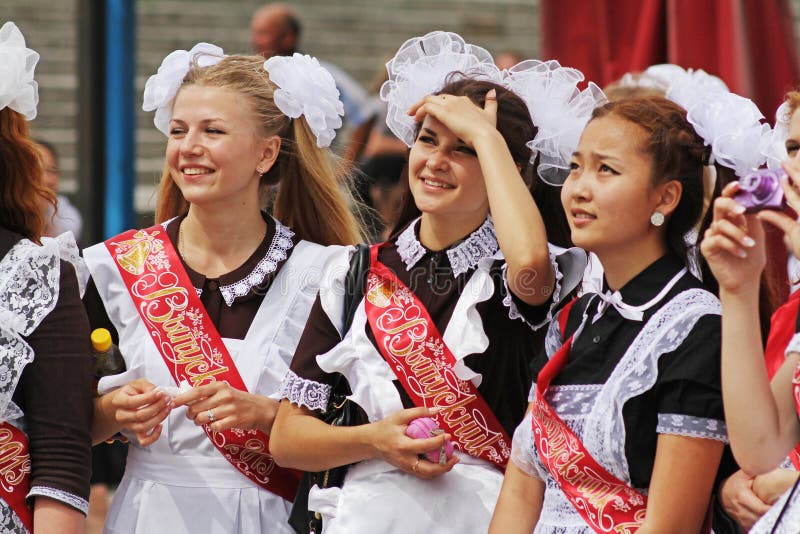 Girls in Soviet School Uniform, the Bows and the Ribbon `Graduate` on ...