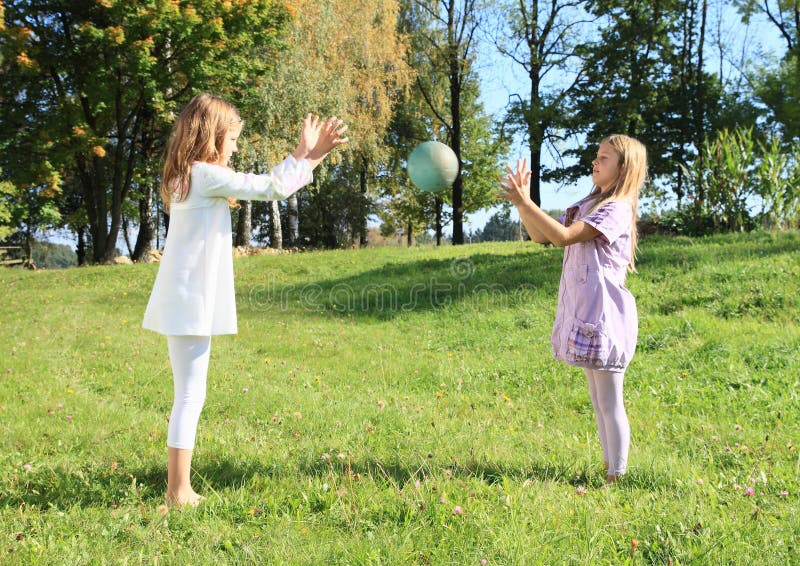 Girls throwing a ball stock photos Girls throwing a ball stock photos