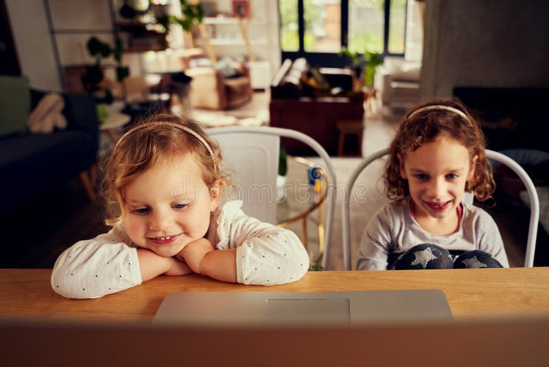 Cute Little Sisters Watching Favourite Cartoon Video on Laptop at Home  Stock Image - Image of lockdown, home: 200017877