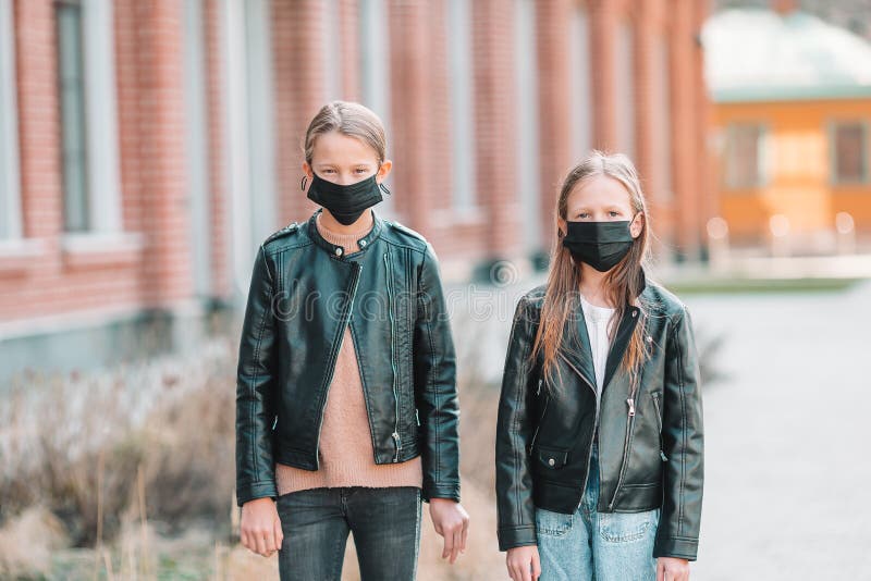 Girls Wearing a Mask on a Background of a Modern Building, Stock Photo ...