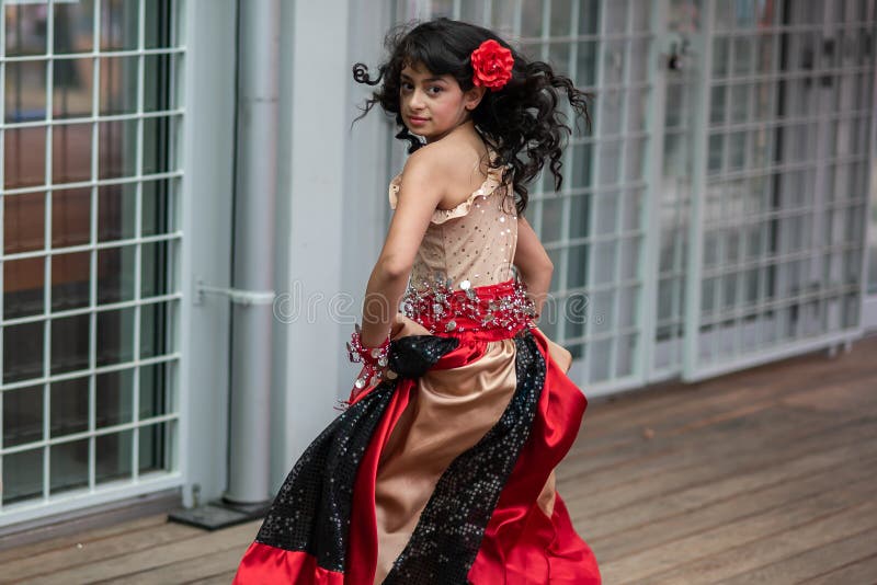 Brno, Czech Republic. 06-11-2016. Girls dancing with traditional costumes at a Festival of Roma people Gypsies in Brno attended by people from the community, with activities for children and adolescents. Brno, Czech Republic. 06-11-2016. Girls dancing with traditional costumes at a Festival of Roma people Gypsies in Brno attended by people from the community, with activities for children and adolescents