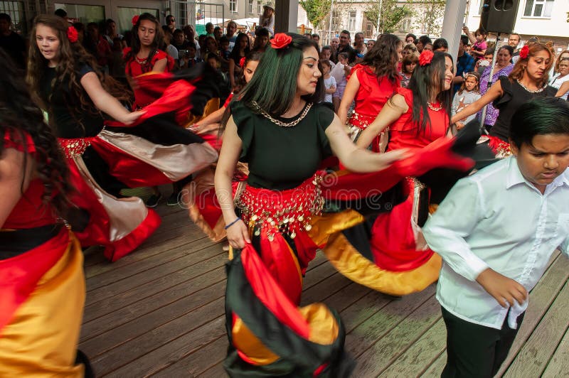 Brno, Czech Republic. 06-11-2016. Girls dancing with traditional costumes at a Festival of Roma people Gypsies in Brno attended by people from the community, with activities for children and adolescents. Brno, Czech Republic. 06-11-2016. Girls dancing with traditional costumes at a Festival of Roma people Gypsies in Brno attended by people from the community, with activities for children and adolescents