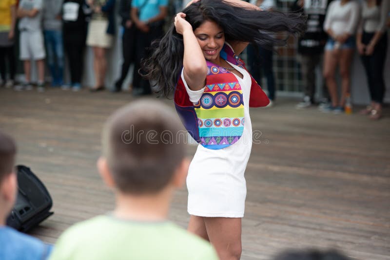 Brno, Czech Republic. 06-11-2016. A Gypsy young woman modeling at a Festival of Roma people Gypsies in Brno attended by people from the community, with activities for children and adolescents. Brno, Czech Republic. 06-11-2016. A Gypsy young woman modeling at a Festival of Roma people Gypsies in Brno attended by people from the community, with activities for children and adolescents