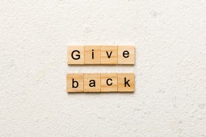 Give Back Word Written On Wood Block Give Back Text On Table Concept 