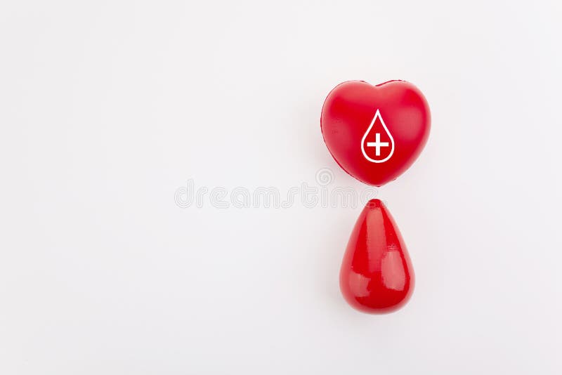 Giving blood saves live. Blood Donation concept. Red heart and blood drop on white background