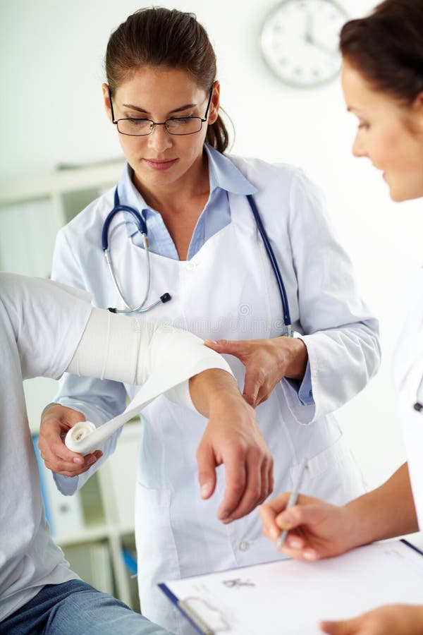 Giving first aid stock image. Image of caucasian, clinician 25939601