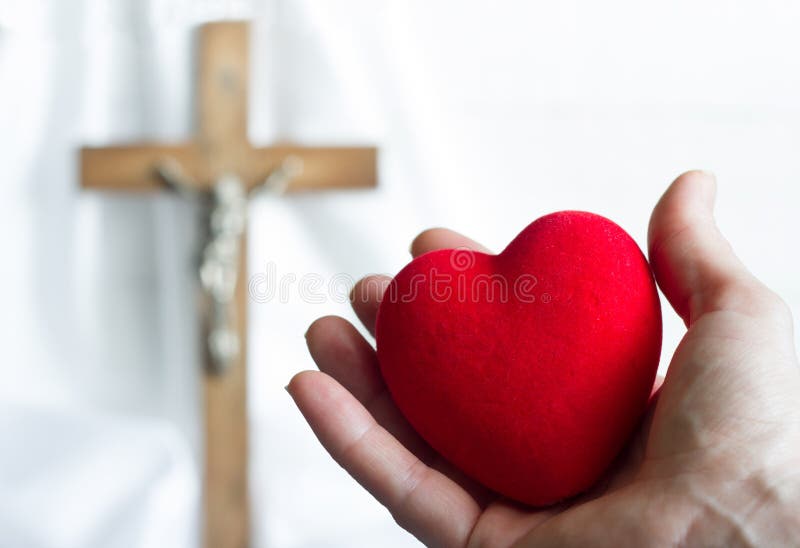 Giving heart to Jesus abstract concept with easter cross. On a white background royalty free stock photo Giving heart to Jesus abstract concept with easter cross. On a white background royalty free stock photo