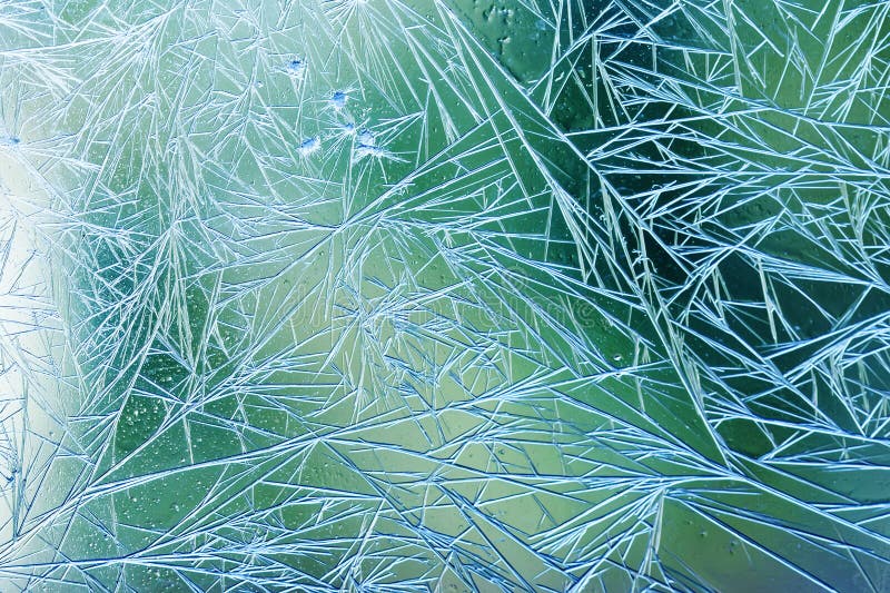 Glacez les fleurs et la vue congelée de macro de fenêtre de vert bleu Modèle de texture de Frost concept froid de fond de Noël de photographie stock Glacez les fleurs et la vue congelée de macro de fenêtre de vert bleu Modèle de texture de Frost concept froid de fond de Noël de photographie stock
