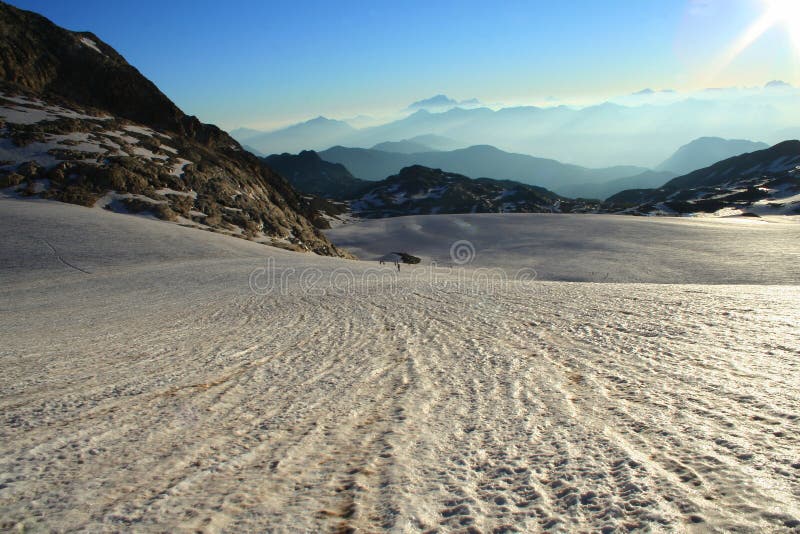 A big glacier in the French Alps with a hard sun in summer. A big glacier in the French Alps with a hard sun in summer