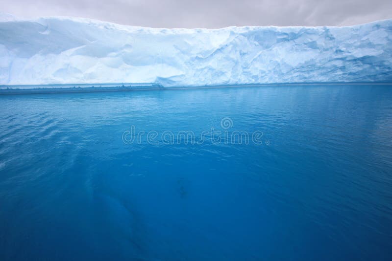 Glacier, iceberg in blue water in Antarctica. Glacier, iceberg in blue water in Antarctica