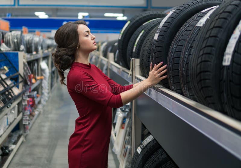 Female customer choosing new tires