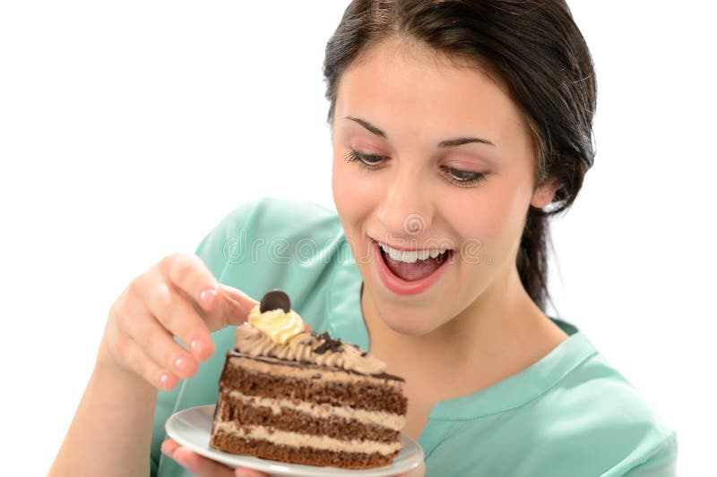 Joyful young girl eating tasty piece of cake. Joyful young girl eating tasty piece of cake