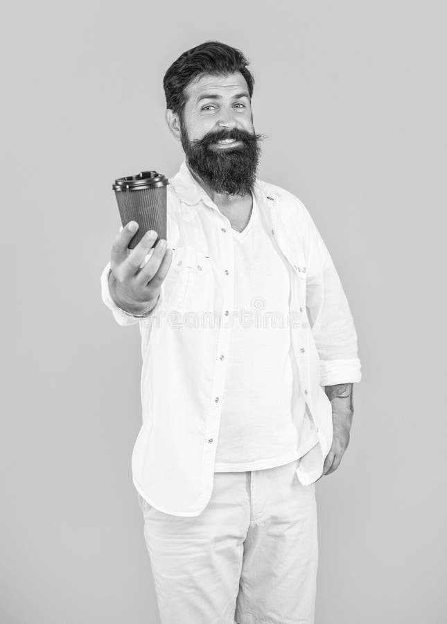 Glad Guy with Morning Coffee in Studio. Photo of Guy with Morning