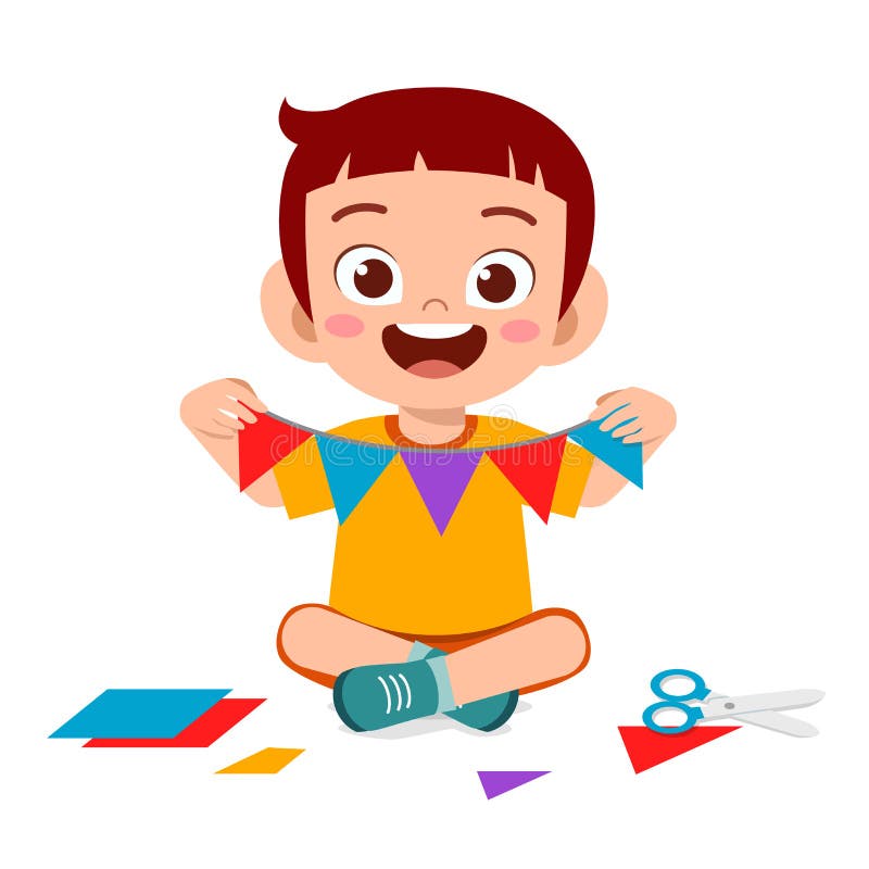 glad söt liten pojke som gör papper till hantverk