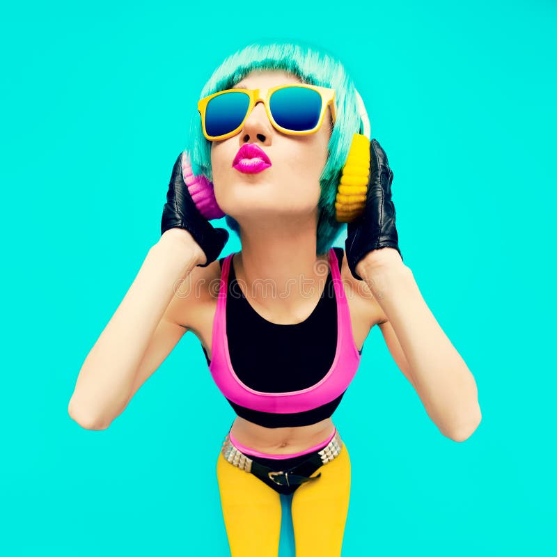 Glamorous Fashion DJ Girl in bright clothes on a blue background