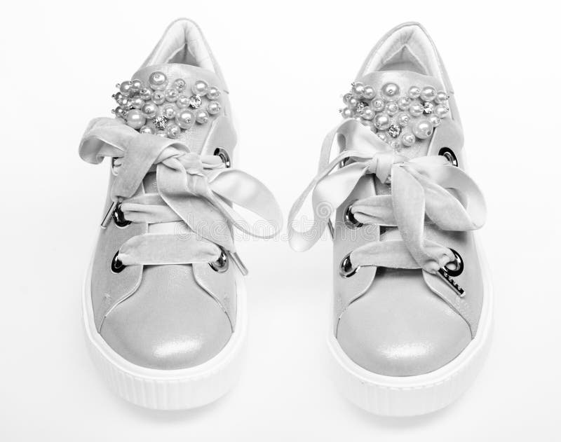 Glamorous Sneakers Concept. Pair of Pale Pink Female Sneakers with ...