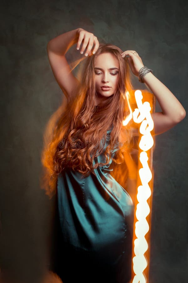 Glamorous Young Woman Dancing in Mixed Light at Studio Stock Image ...