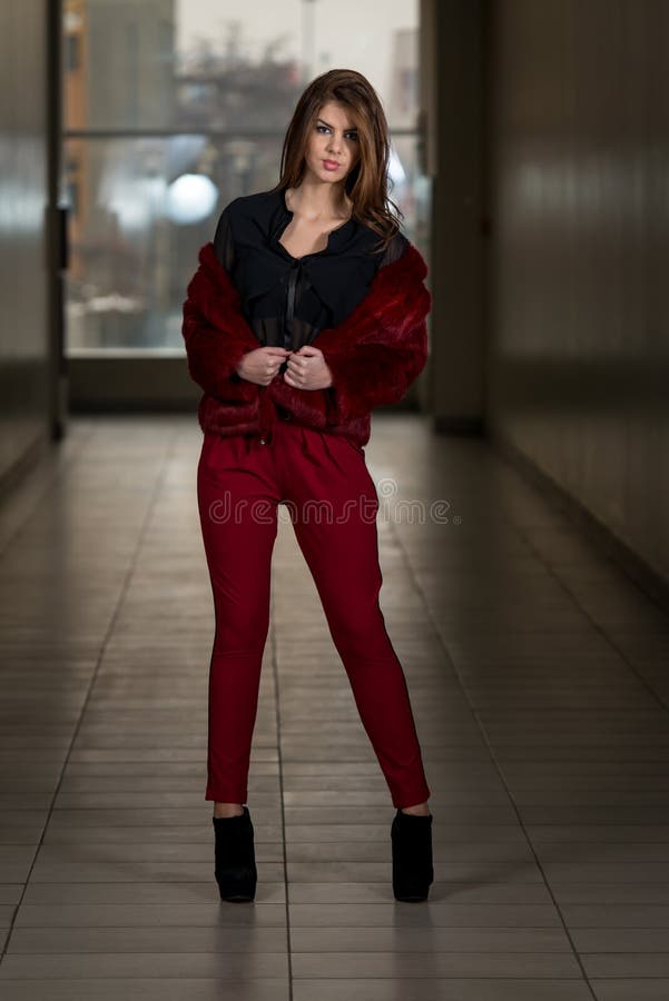 Glamour Fashion Model Wearing Red Pants And Jacket