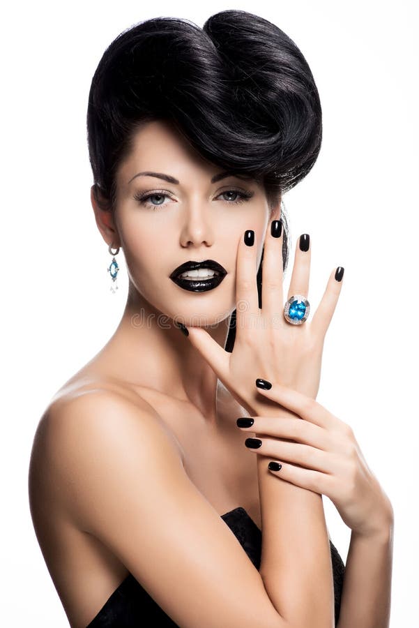 Glamour woman's nails , lips and eyes painted color black. stock photos Glamour woman's nails , lips and eyes painted color black. stock photos