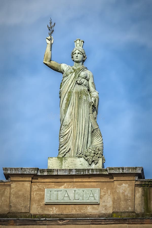 The Italia statue by ander Stoddart on top of the Italian Centre in the Merchant City area of Glasgow, Scotland. The Italia statue by ander Stoddart on top of the Italian Centre in the Merchant City area of Glasgow, Scotland.