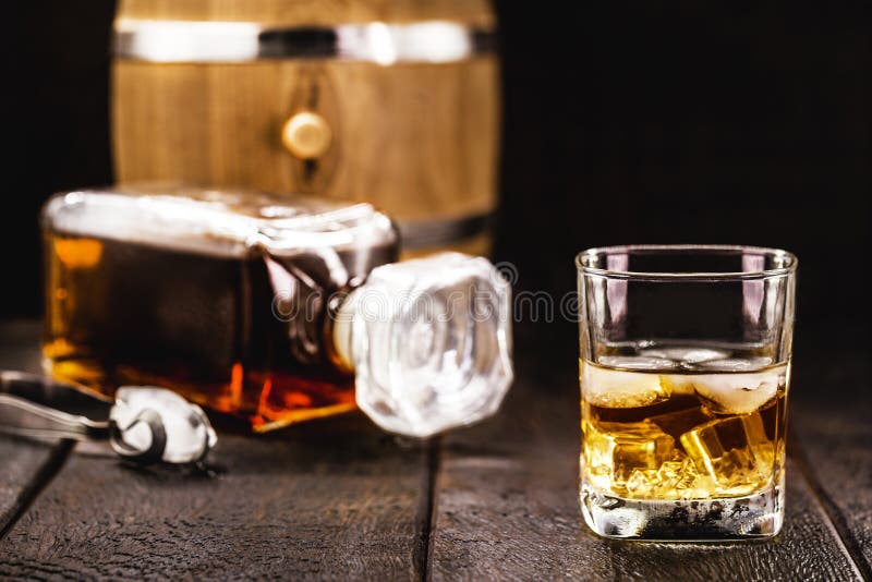 Glass of Aged Whiskey, Grain Distilled Alcohol, with Malt, Aged in Barrels Stock Photo Image