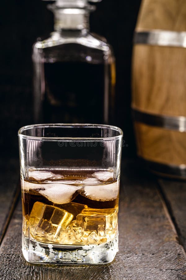 Glass of Aged Whiskey, Grain Distilled Alcohol, with Malt, Aged in Barrels Stock Photo Image