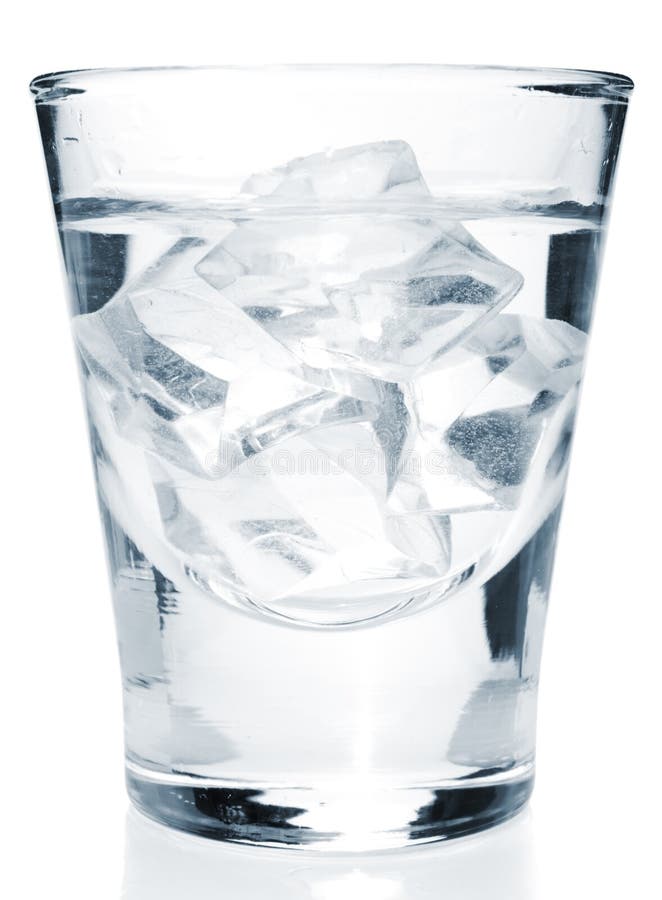 Glass with alcohol drink with ice cubes inside, isolated