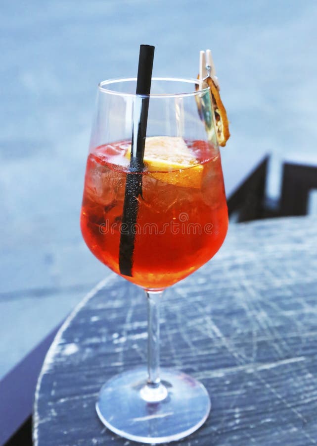 Glass of Aperol Spritz Cocktail Champagne with Fresh Orange Juice