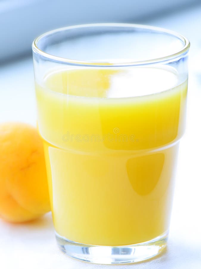 Glass of apricot juice stock image. Image of refreshment 25341309