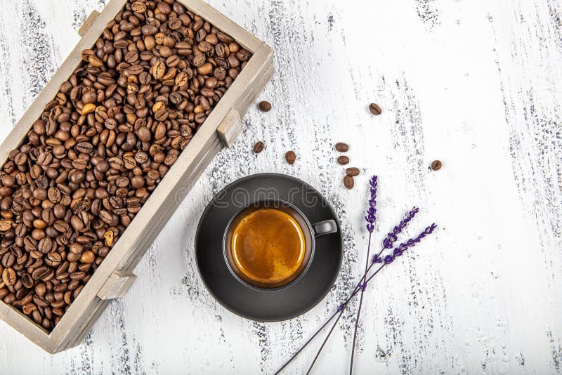 Glass of Aromatic Ristretto Coffee with Smoke. Coffee on the Table in