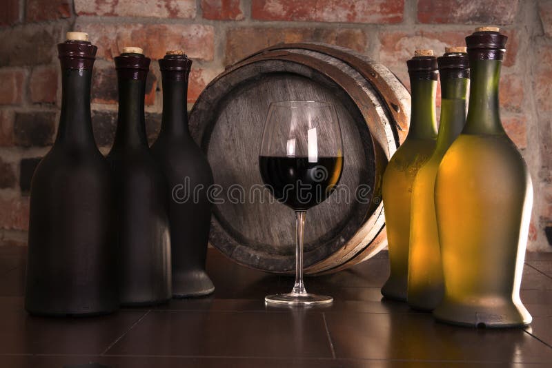 Glass,barrel and a bottle of wine