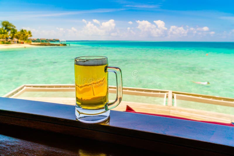 A Glass of Beer with Beautiful Tropical Maldives Island . Stock Photo ...
