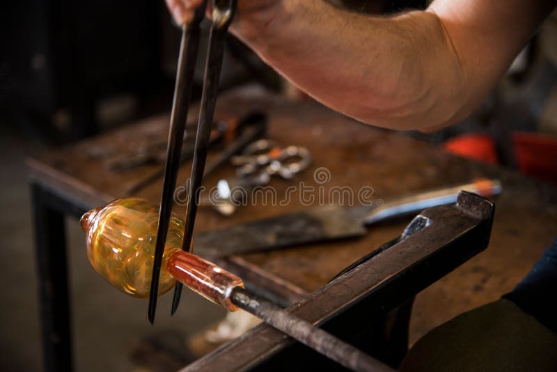 Glass Blower Making Yellow Glass Mold with High Heat Fire for Shaping