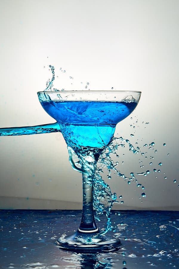 Glass with Blue Champagne or Cocktail. Levitation Stock Image - Image ...