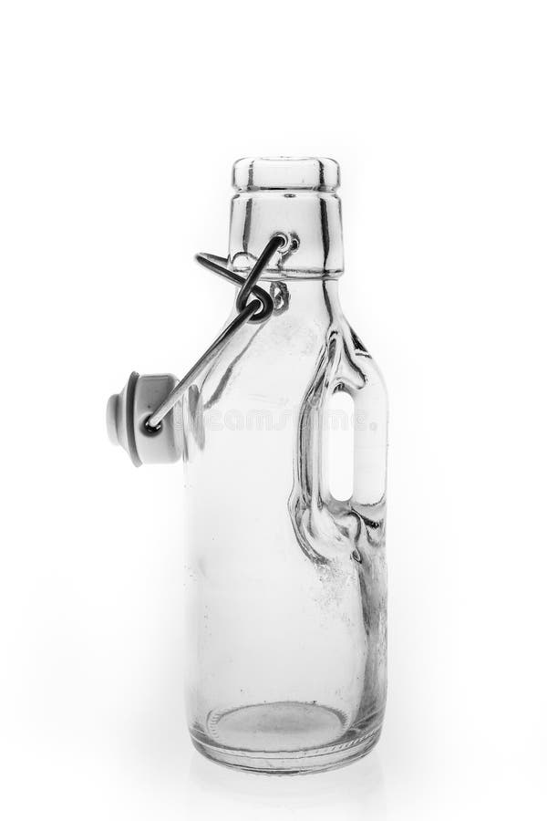 Glass Bottle with an Old Bottle Cap. Thick Glass Container for Storing