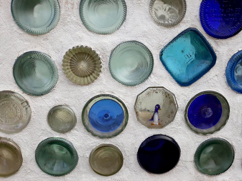 Glass bottles on concrete wall royalty free stock photo