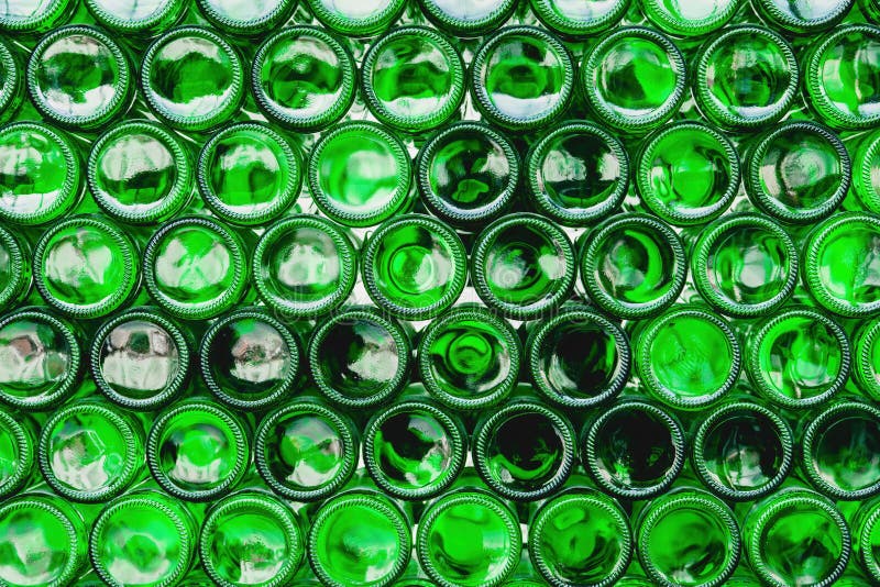 Glass Bottles Green. Green Glass Bottles of Beer. Wall Formed by Green
