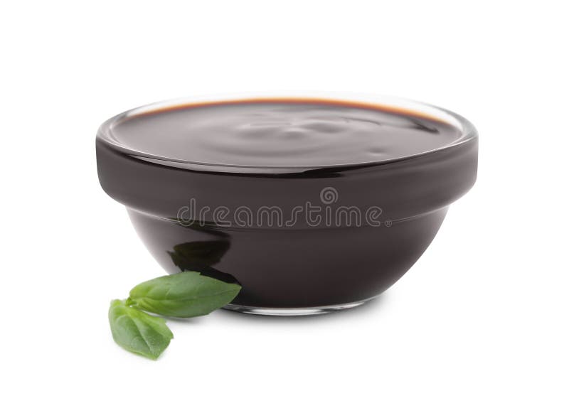 Glass Bowl with Balsamic Glaze and Basil Leaves on White Background