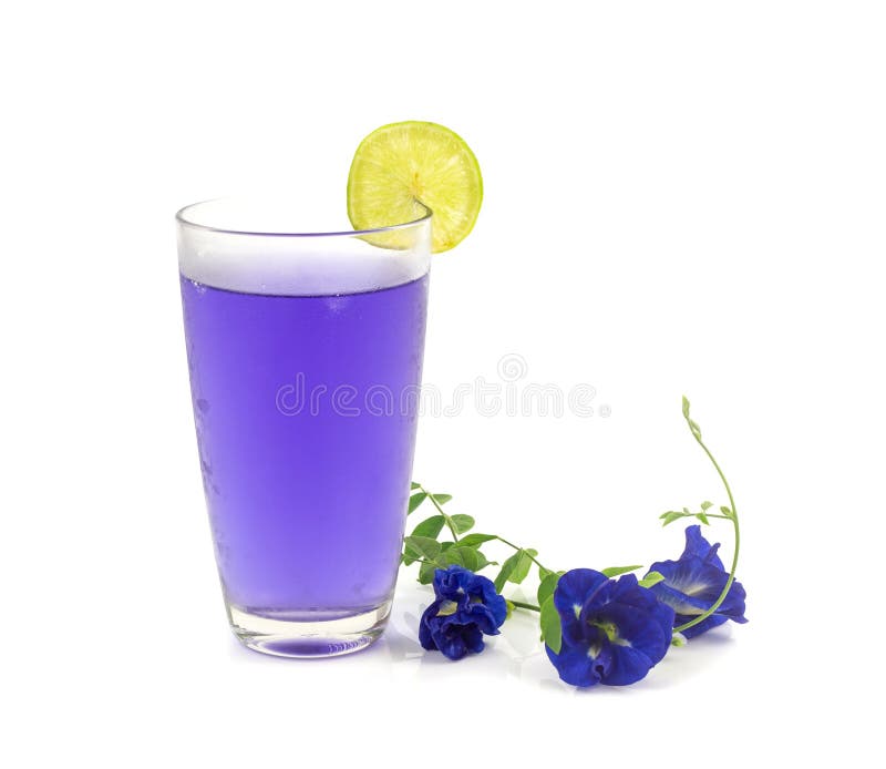 Glass of butterfly pea flower juice on white background